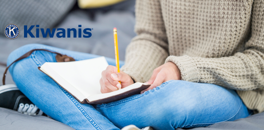 photo of a teen writing in a journal